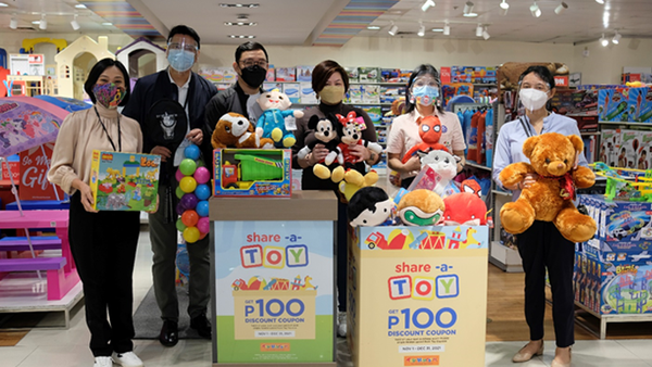 Representatives from The SM Store, Toy Kingdom, and HSBC Global Service Centre Philippines during the turn-over of donations held at The SM Store North EDSA