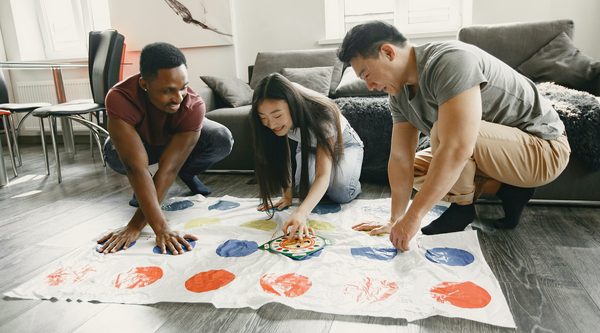 Family playing Hasbro Twister