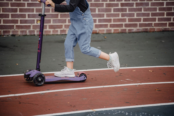 Kid riding a scooter